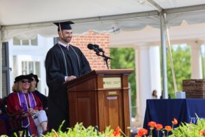 Stuart Nystrom (Class of 2026) addresses 2026 Darden academic regalia ceremony attendees